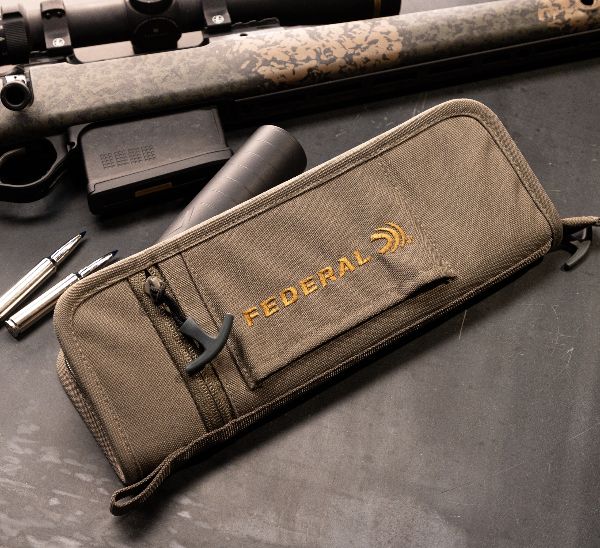 Tan case on a workbench.