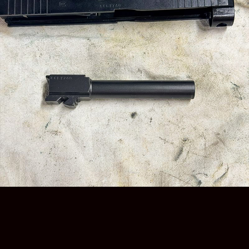 A black barrel on a white cloth