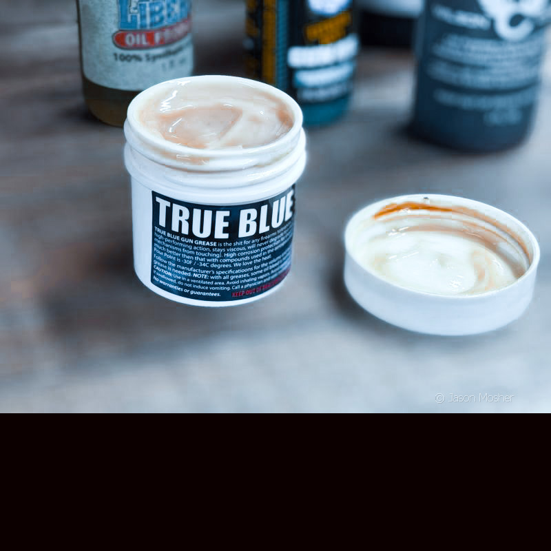 A white bottle with a blue label that reads "True Blue".