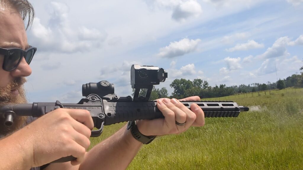 Left-side profile of a KelTec SUB2000 pistol-caliber carbine showing the Mars Mini thermal unit mounted inline forward of a Primary Arms micro prism optic.
