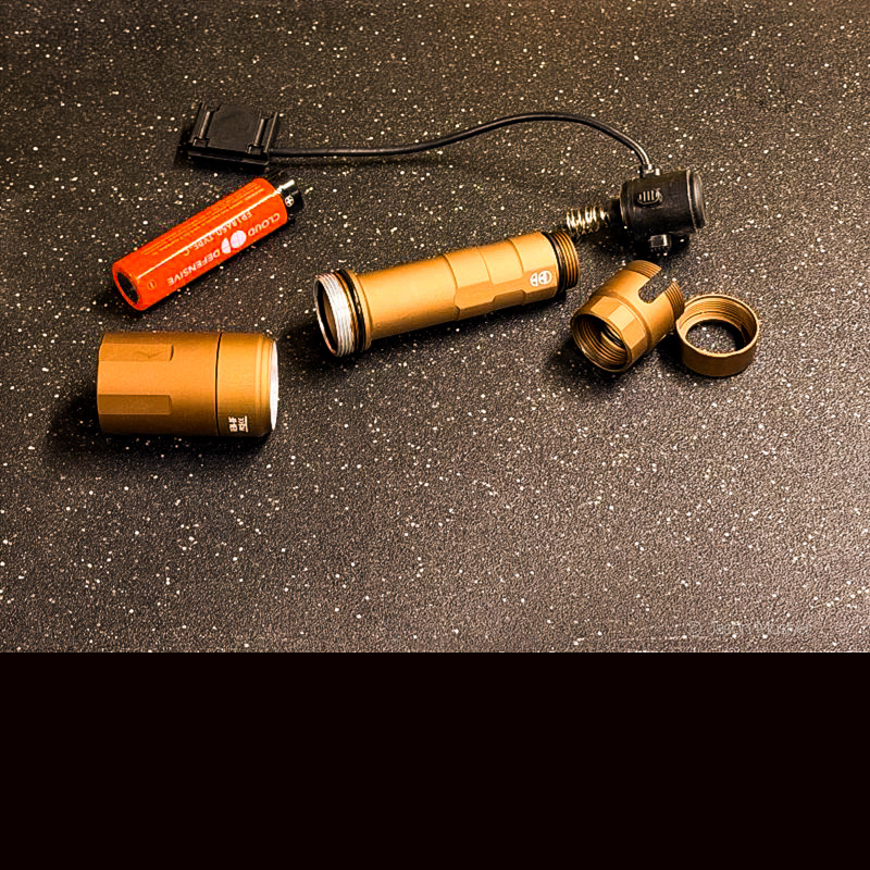 The REIN light in pieces on a black surface. 