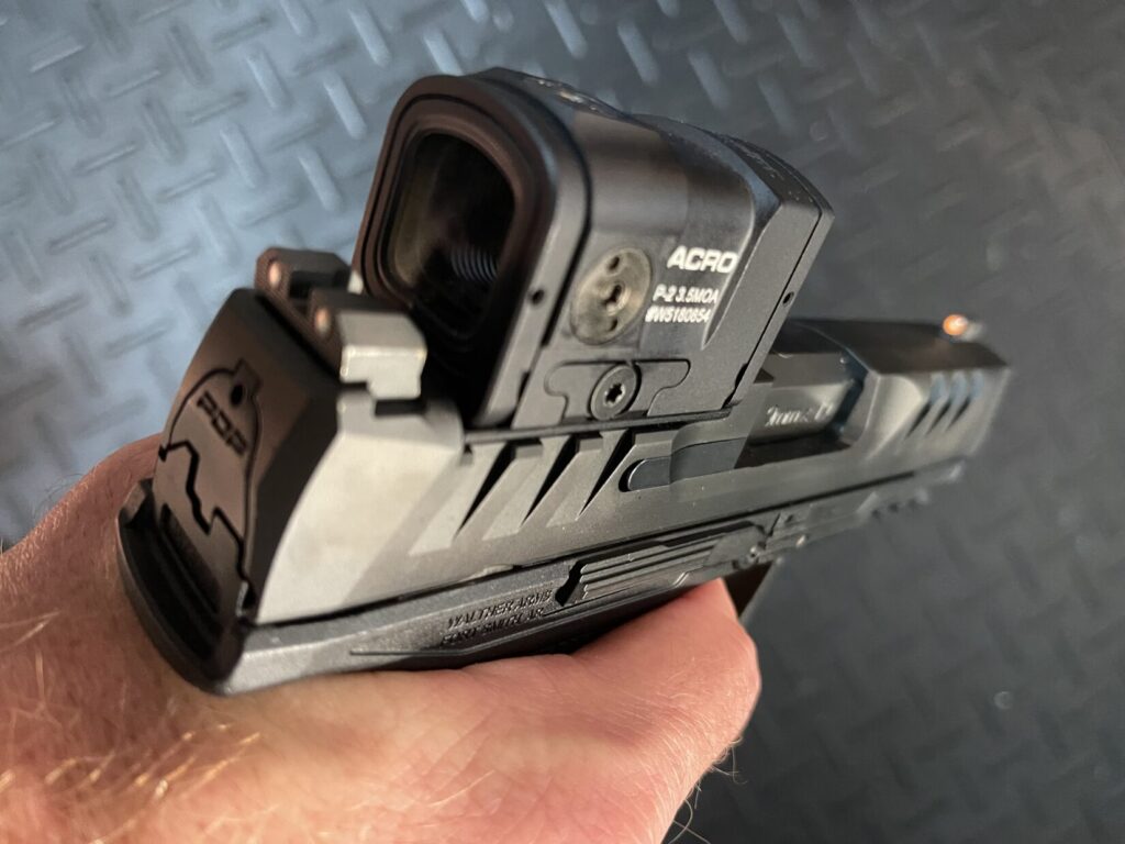 pictured is Rick Hogg of War HOGG Tactical demonstrating how more trigger finger reduces the gap between the trigger finger and frame of the pistol.