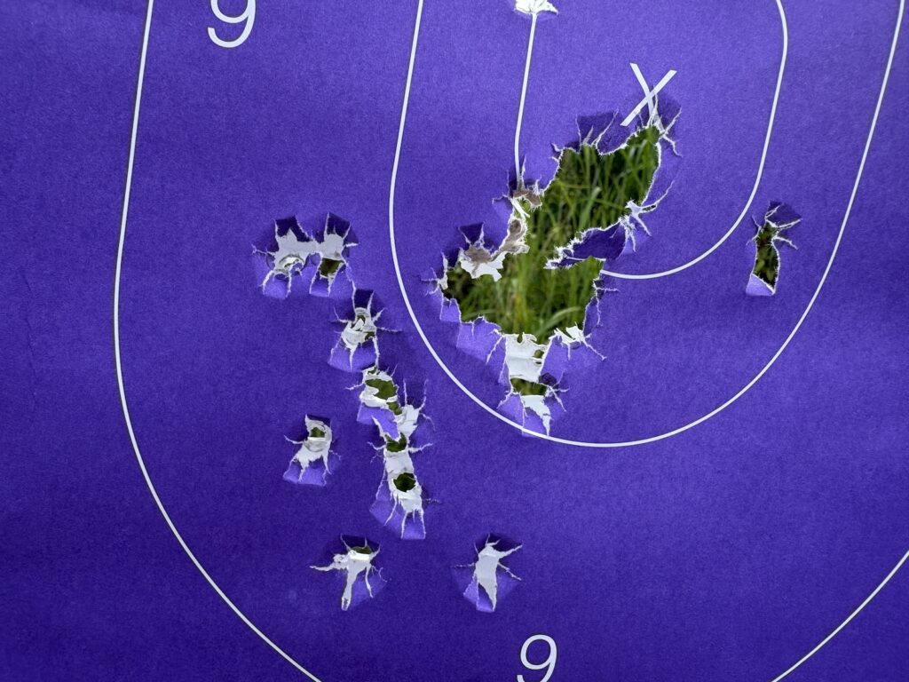 A target with 9mm bullet holes from the G45.