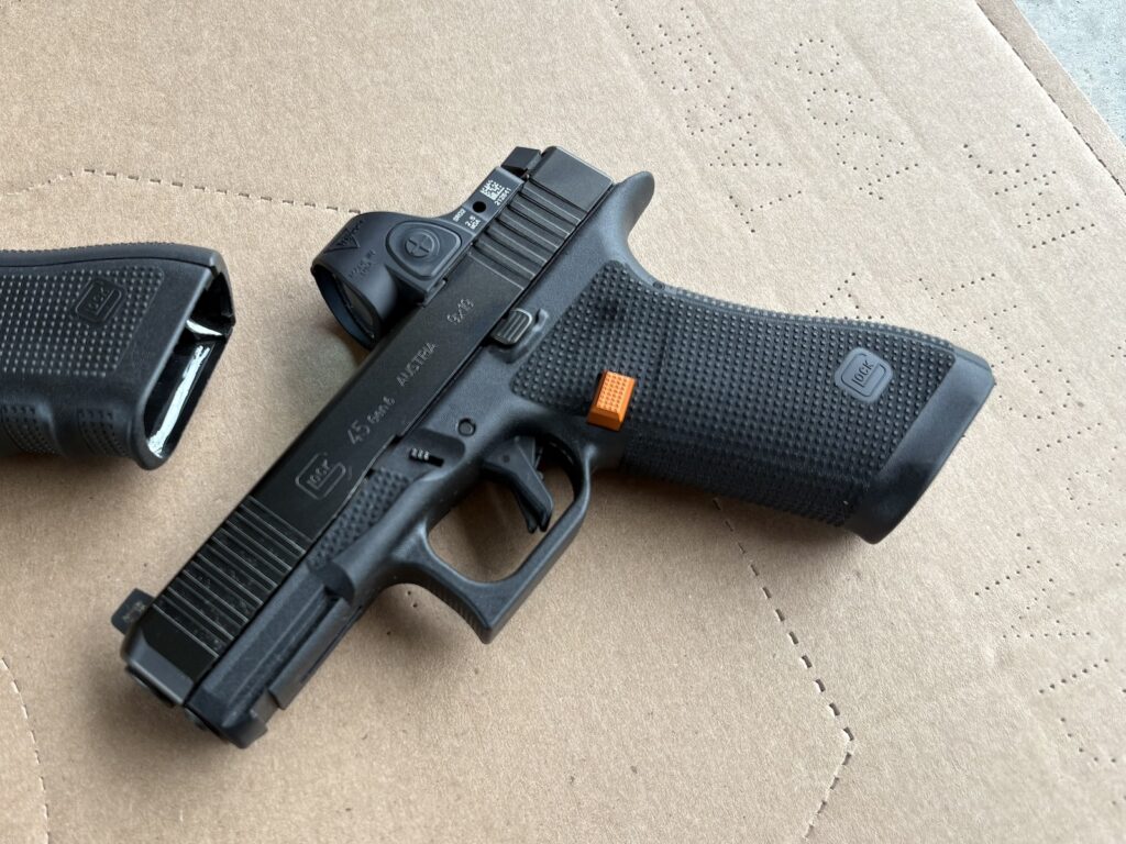 a gen 6 G45 with an orange mag release