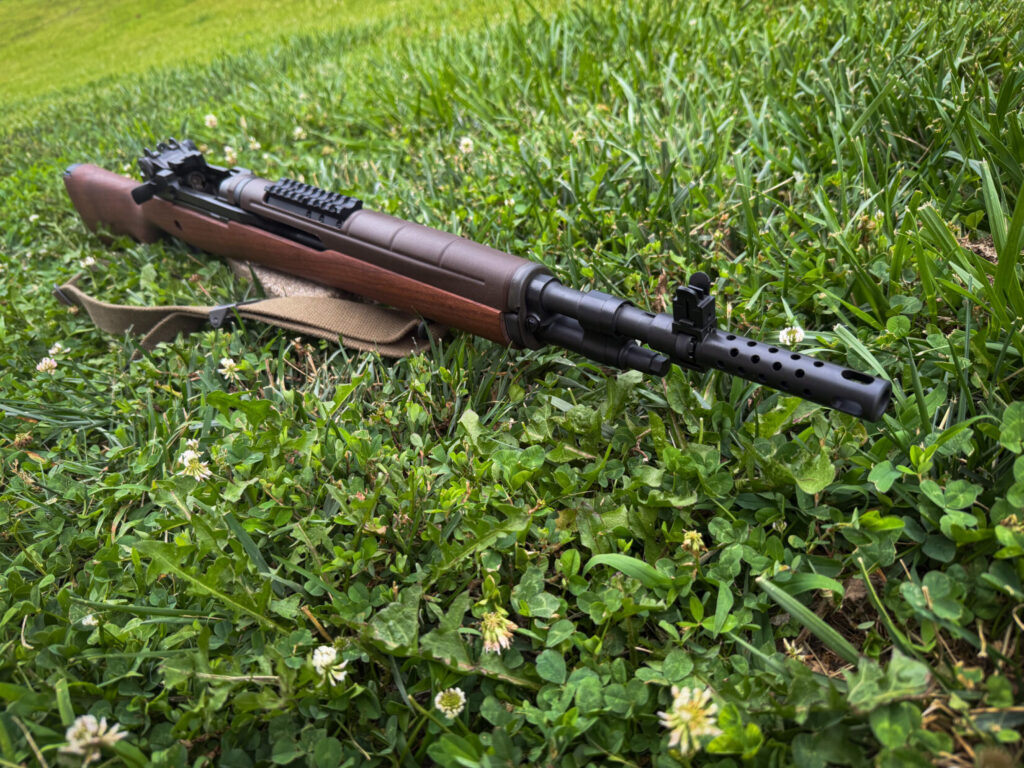 classic wood stock semi-automatic rifle on a grass background