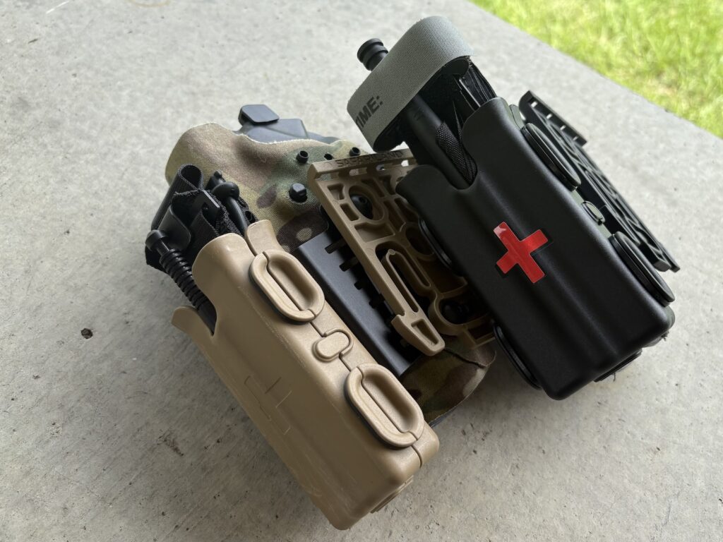 a snakestaff tq and a NAR tq in holster mounted pouches