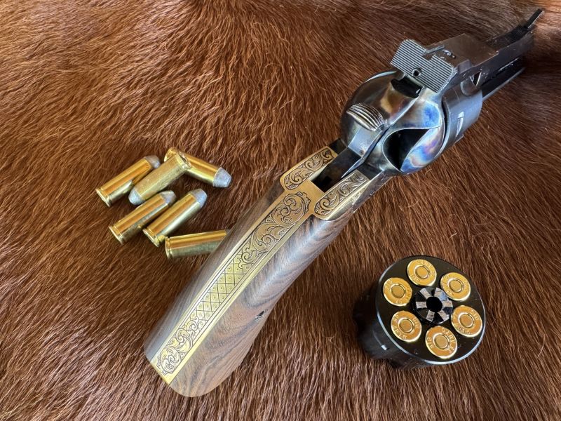 Hand engraving by Ricky Sharp adorns the brass grip frame on this custom revolver.