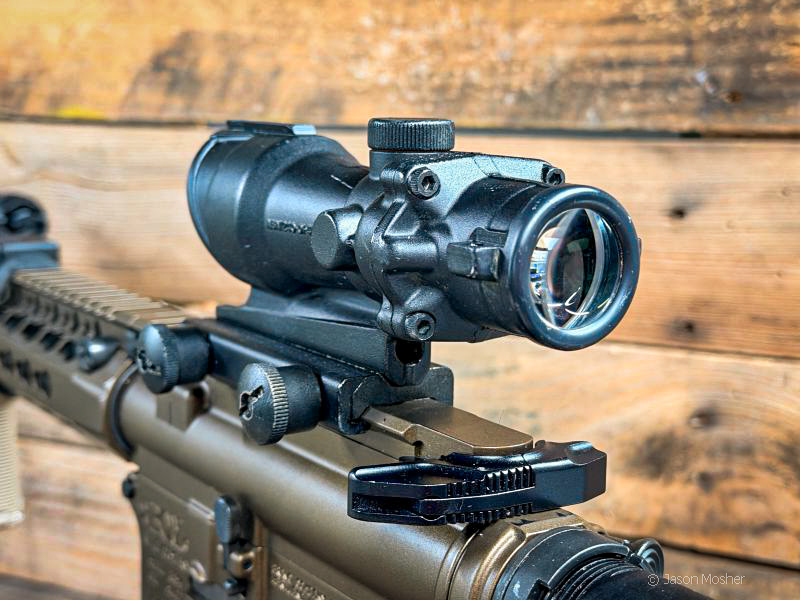 A view of the back of an ACOG optic, mounted on an AR-15 rifle.