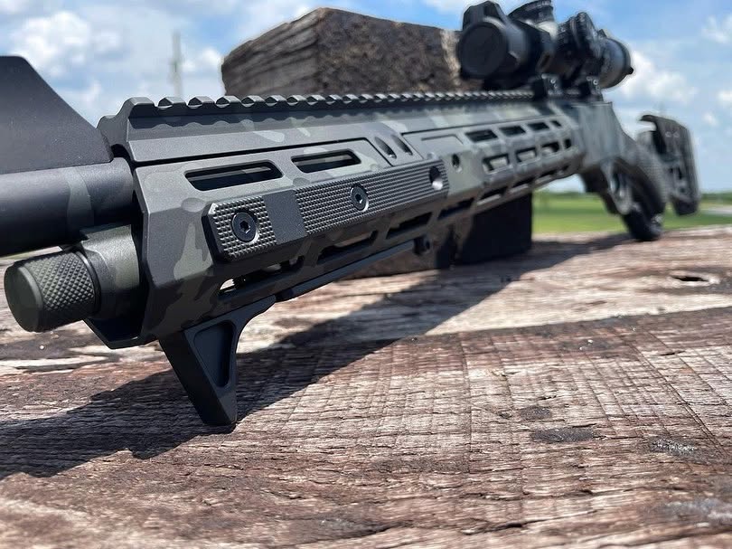 A rifle forend next to a wooden block