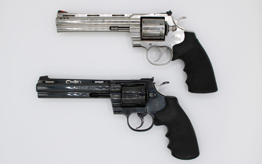 Two revolvers on a white background.