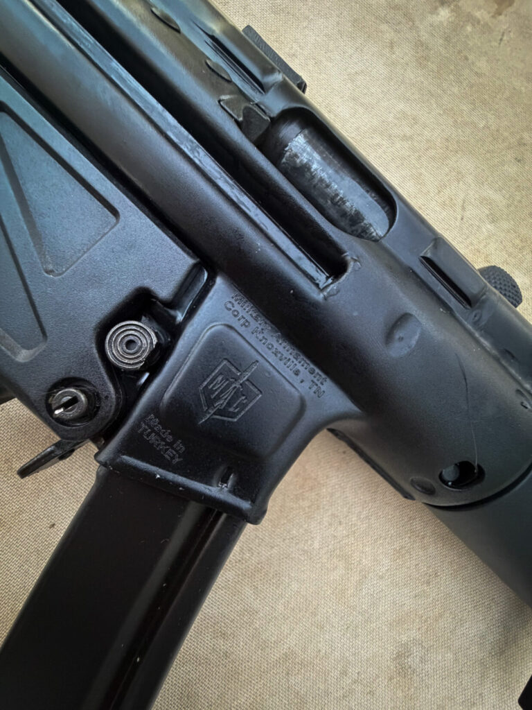 black firearm on a plain background. 