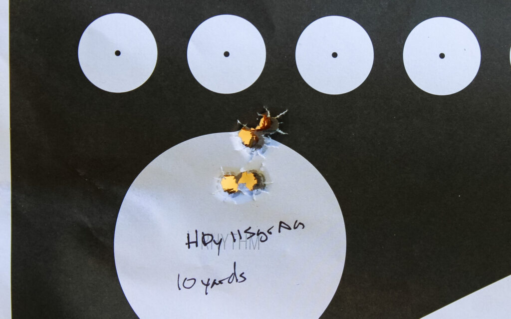 Target showing the MAC 9 DS Comp's 10-yard accuracy test, with two tight clusters about an inch apart