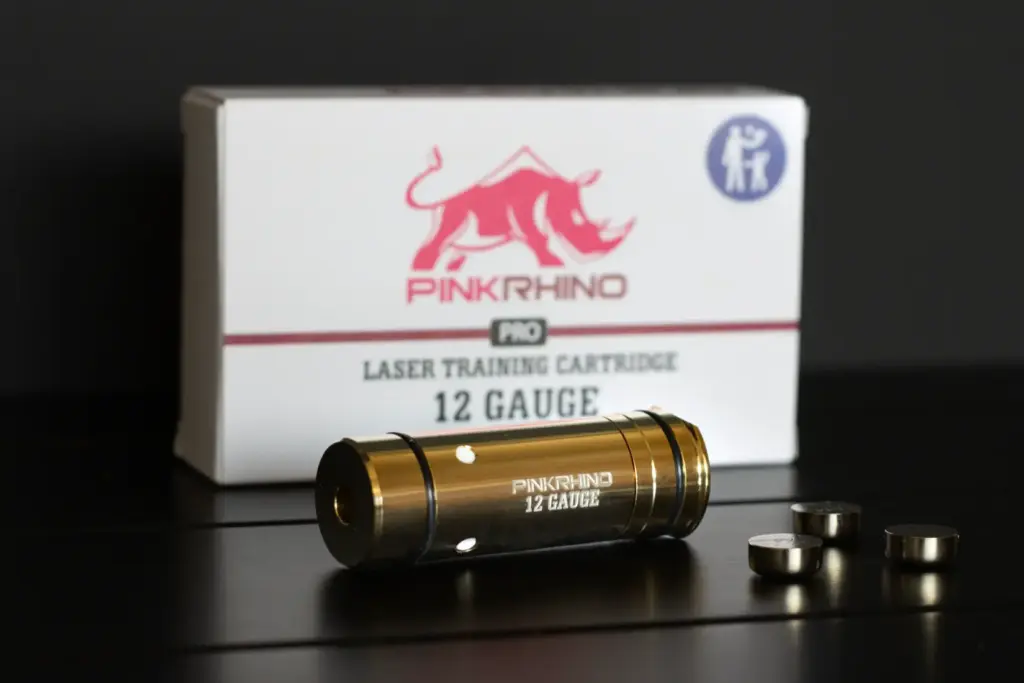 Brass lazer case on a black table.