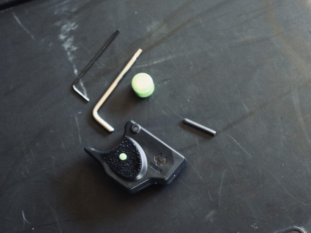 To assemble the E-Series laser onto the frame, you need to replace the stock pin in the frame.
