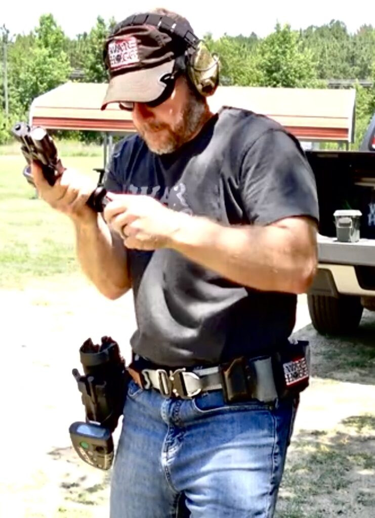 Screenshot of Rick Hogg, lead instructor at War HOGG Tactical reviewing the tape of his shooting performance during the War HOGG Skill builder Combing Skills