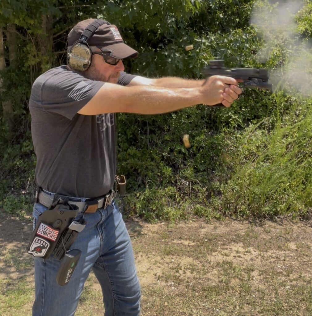 Rick Hogg, lead instructor at War HOGG Tactical is demonstrating his draw from a holster using a Safariland level III holster.