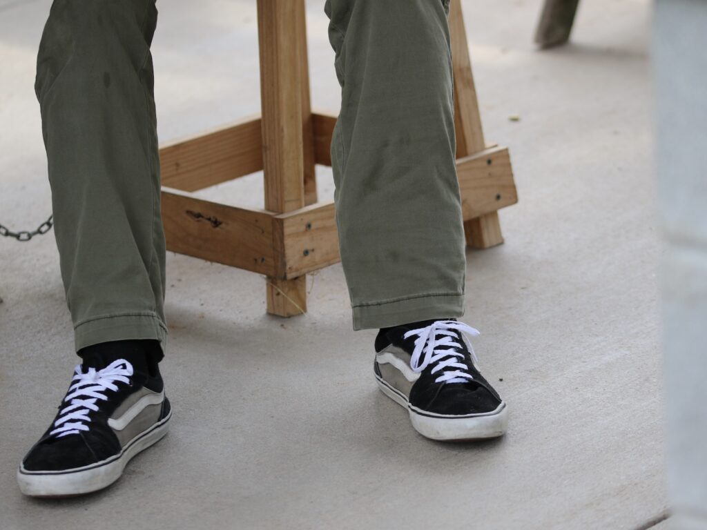 Ankle holsters don't play well with skinny jeans. You will need straight leg or boot cut or ballooned cargo pants.