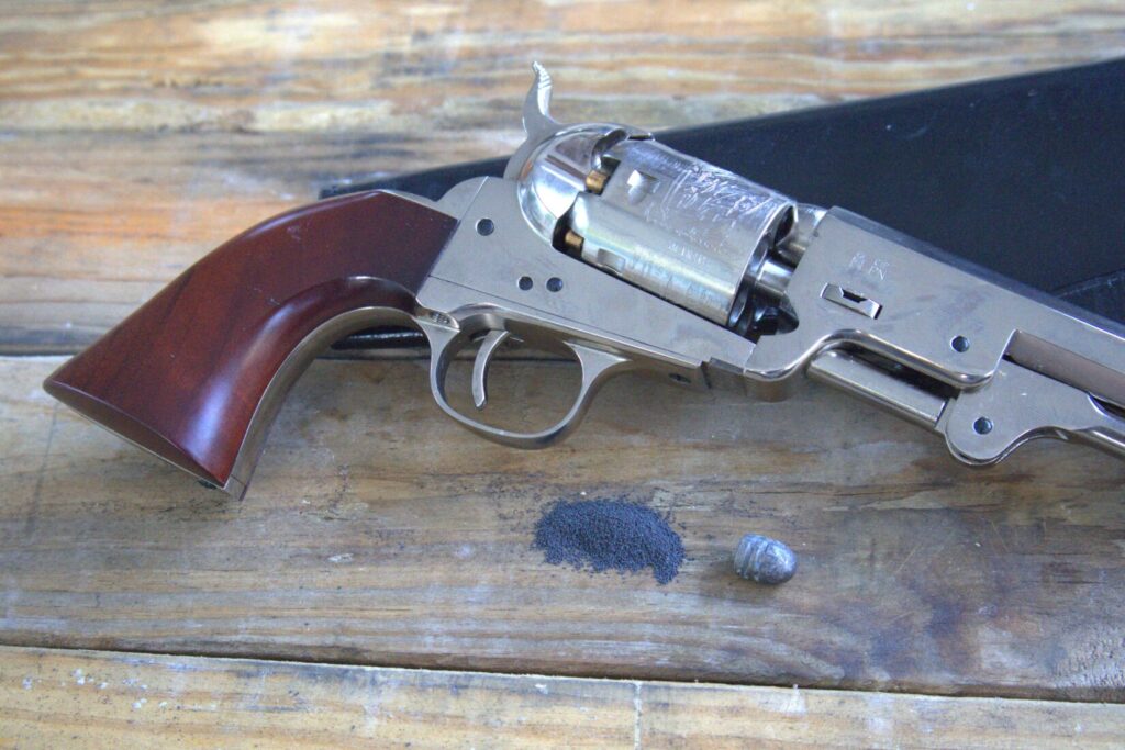 colt 1851 navy revolver with bullet and powder