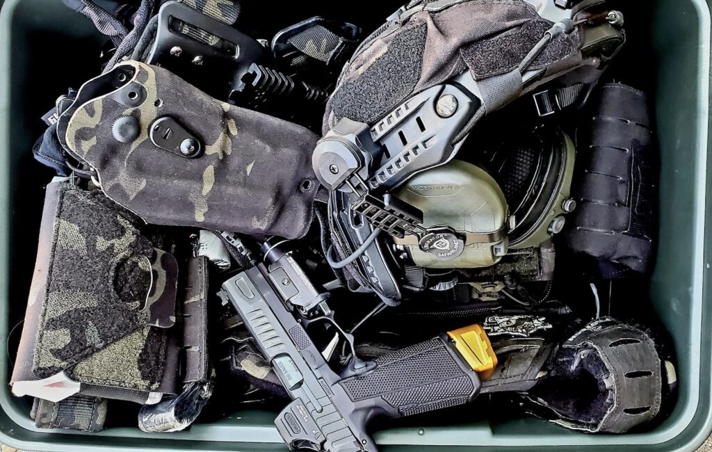 a box full of multicam black tactical gear