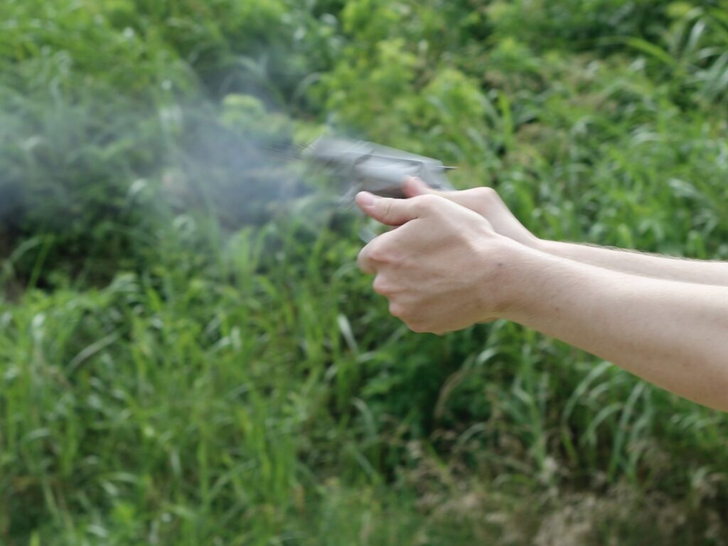a revolver jumping in the hand