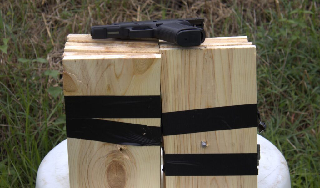 double tap 230 grain board penetration test using a Glock 20 pistol