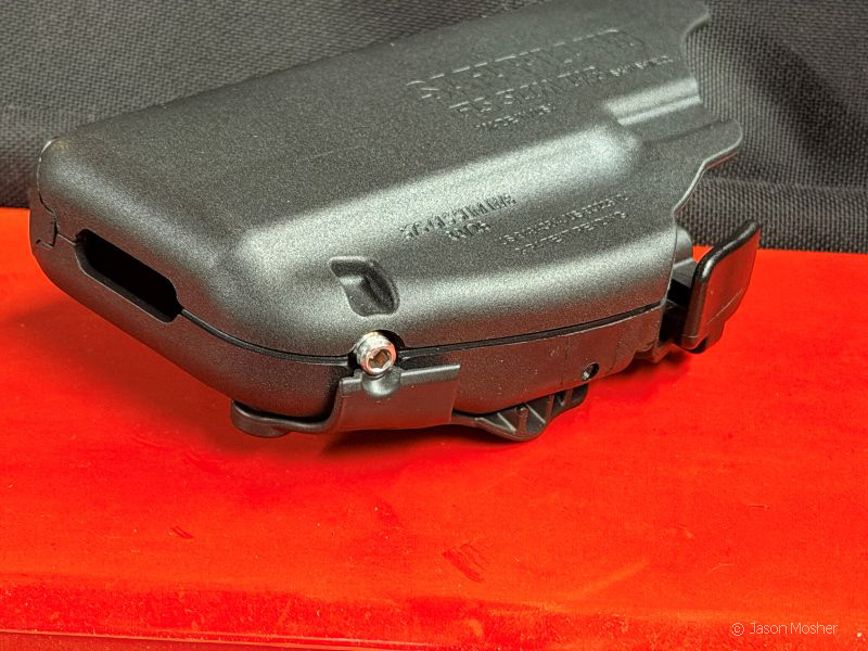 Close-up of the adjustment screw on the 575 Pro-Fit holster, used to fit different handgun frames