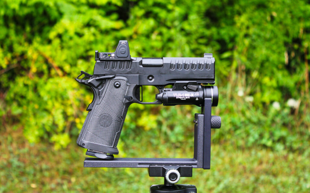 The Watchtower Apache Commander double-stack 1911 in 9mm, shown on a shooting rest