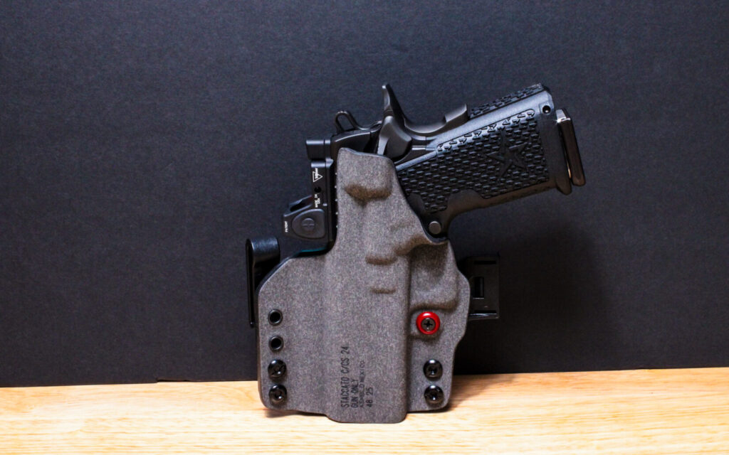 A Staccato C2 pistol holstered in a black Safariland IncogX concealment holster.