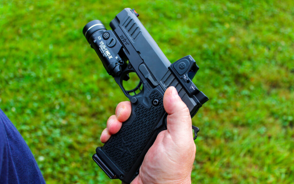 Shooter holding the Staccato C2 compact 2011 pistol at the range