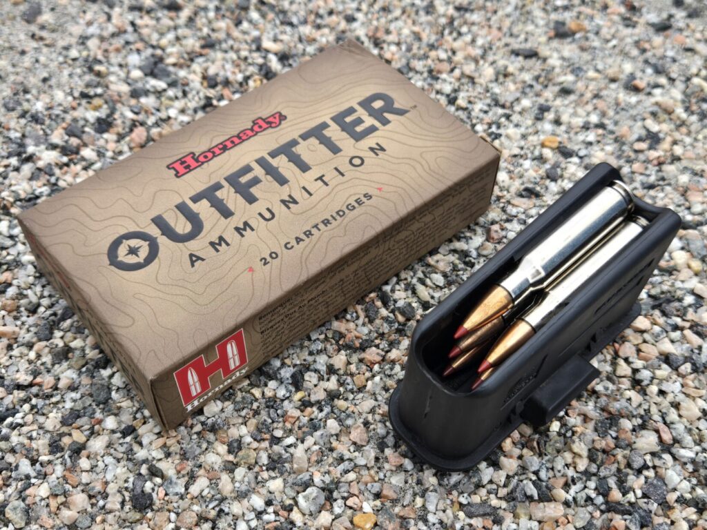 A box of hunting rifle ammunition and a box magazine.
