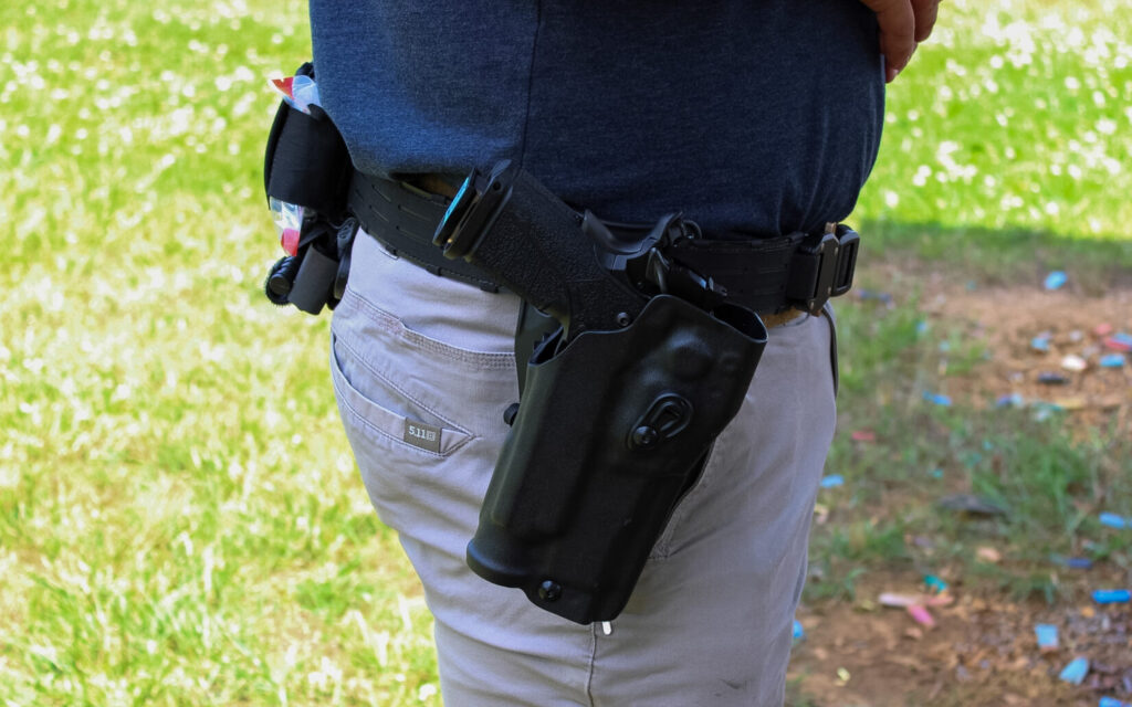 The Kimber DS Warrior LW holstered in the Safariland 6354RDSO ALS Holster with QLS19 Fork, mounted on the Baseline MOLLE Belt