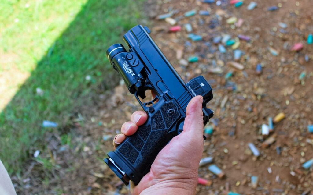 holding the Kimber DS Warrior LW, describing it as a comfortable gun to shoot