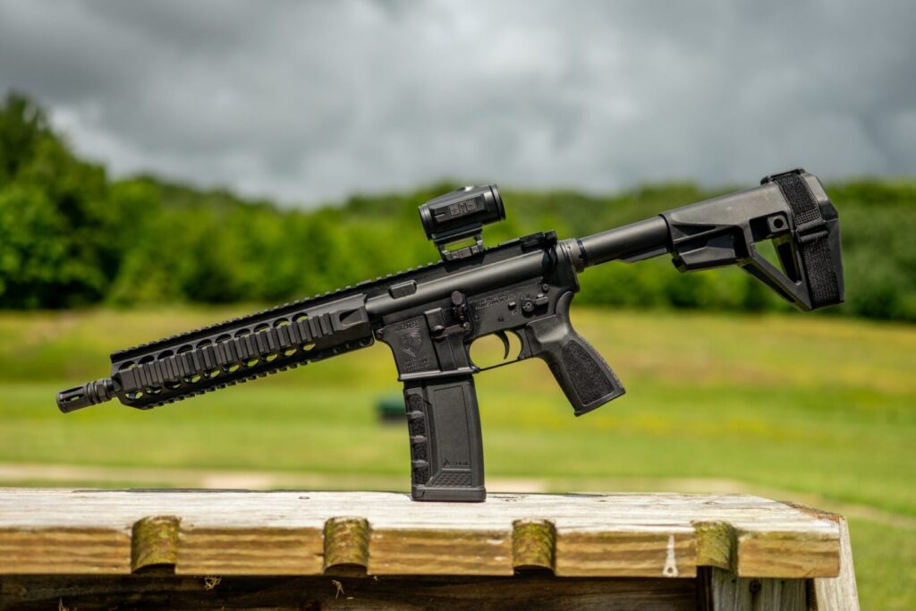 Black rifle with a natural background.