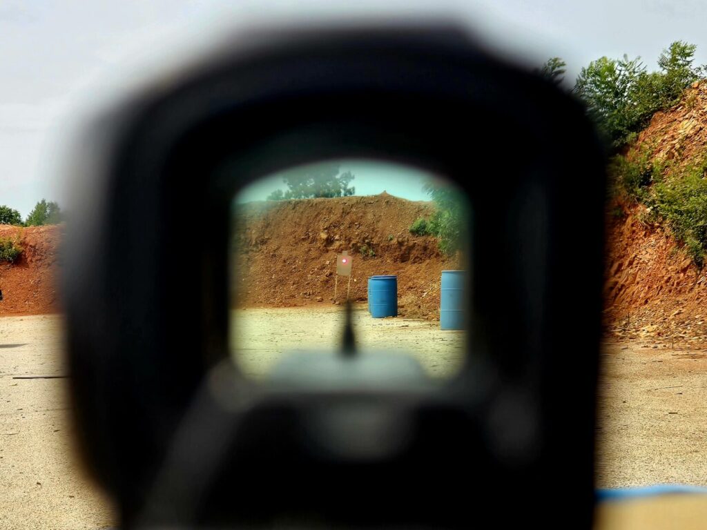 A standard IPSC target at 50 yards viewed through an Aimpoint ACRO, showing the dot's size relative to the target