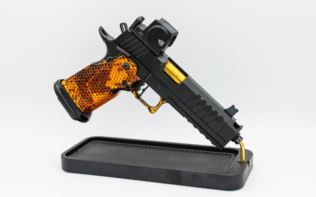 The MasterPiece Arms DS9-TC Hybrid competition 2011 with single-port compensator on a display stand