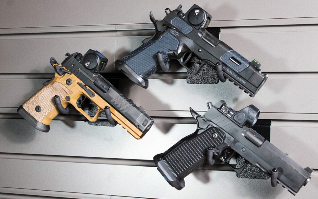 Sig Sauer, Stealth Arms, and Race City Defense double-stack 1911 pistols lined up for testing in the 2011 Project.