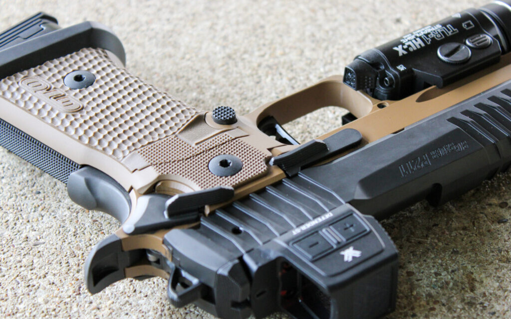 Close-up of the Sig P211 GTO Combat's ambidextrous safety and slide release controls