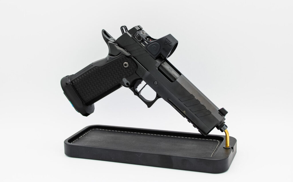 Race City Defense Core 4.6 double-stack 1911 on a display stand