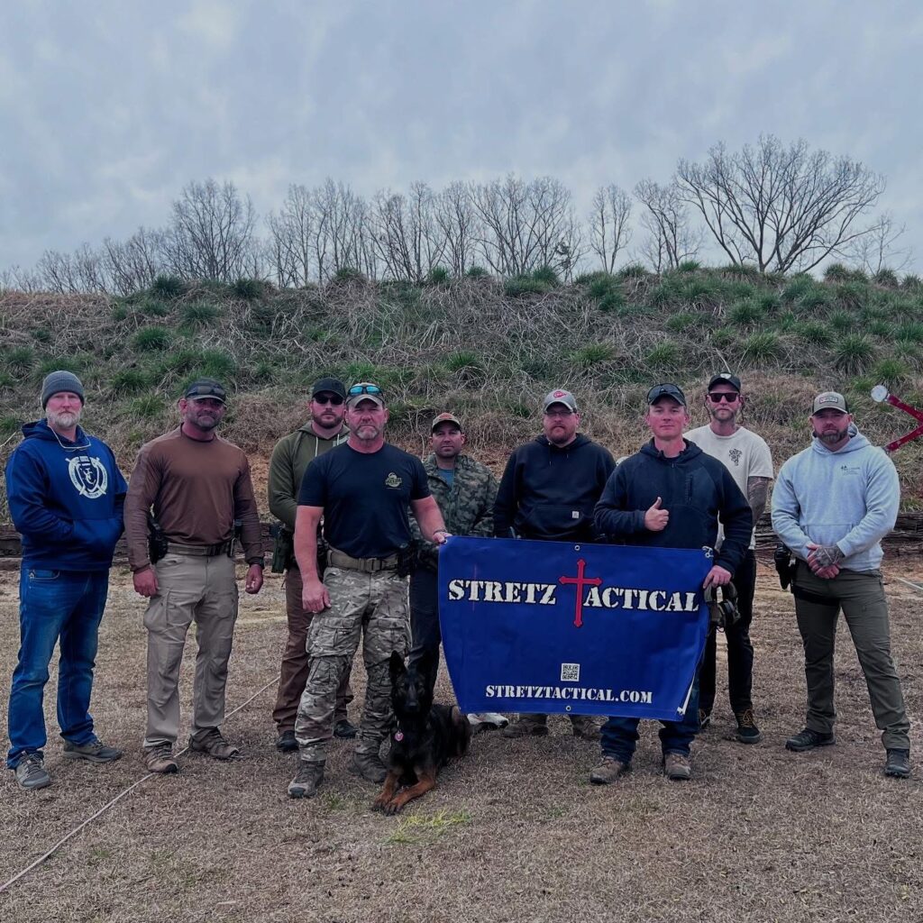 Ken Stretz (Stretz Tactical) and Chris "Dutch" Moyer (DCM Consulting) pose with students at their 2 Day Pistol Collab in Laurens, South Carolina.