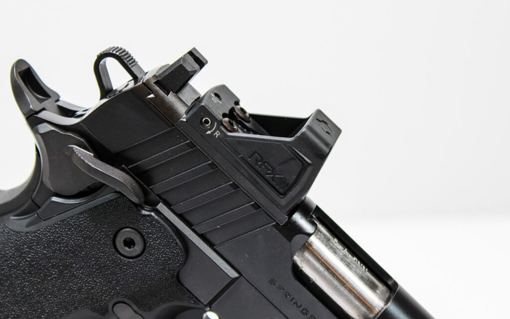 Close-up of the Viridian RFX11 green dot optic mounted on the Prodigy Gear Pac's slide