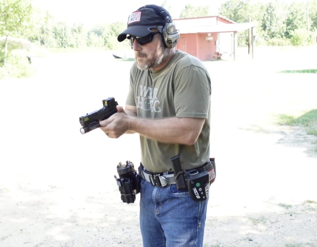 Rick Hogg, primary instructor at War HOGG Tactical, reviewing draw stroke and light switch manipulation