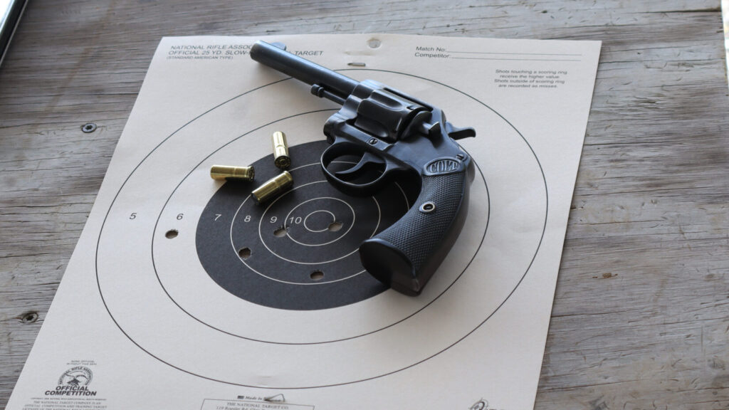Target showing the author's first five-round group with the Colt New Police at 25 yards