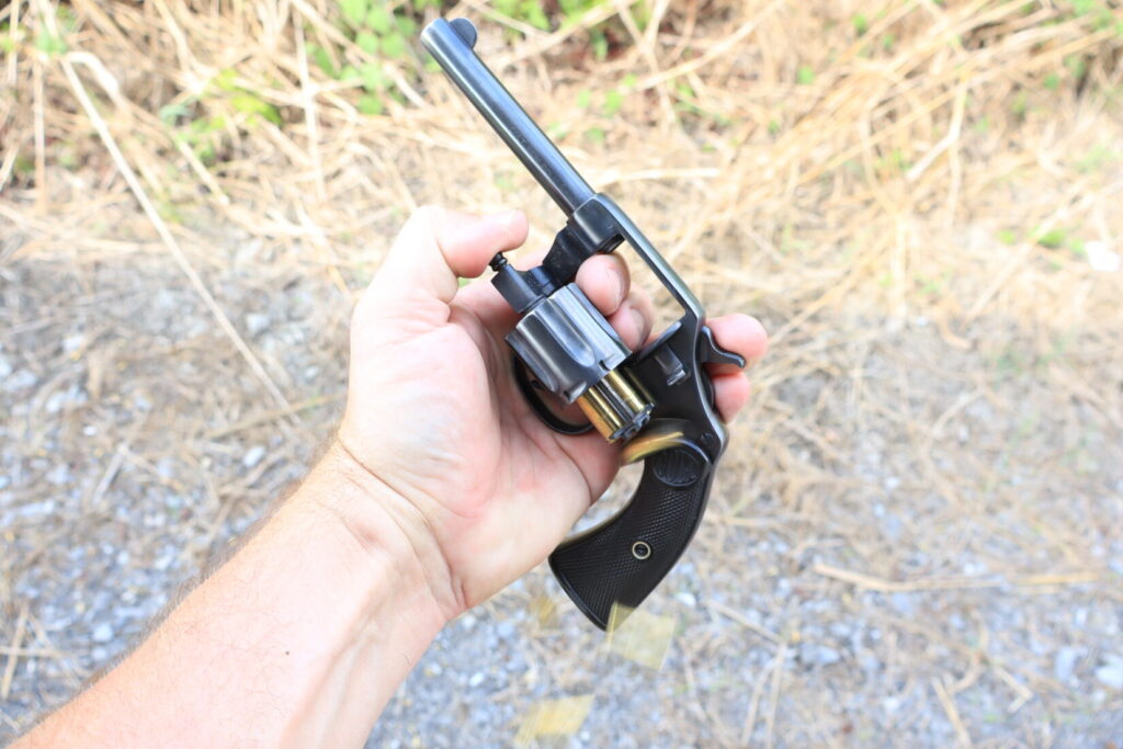 Colt New Police revolver ejecting spent brass casings