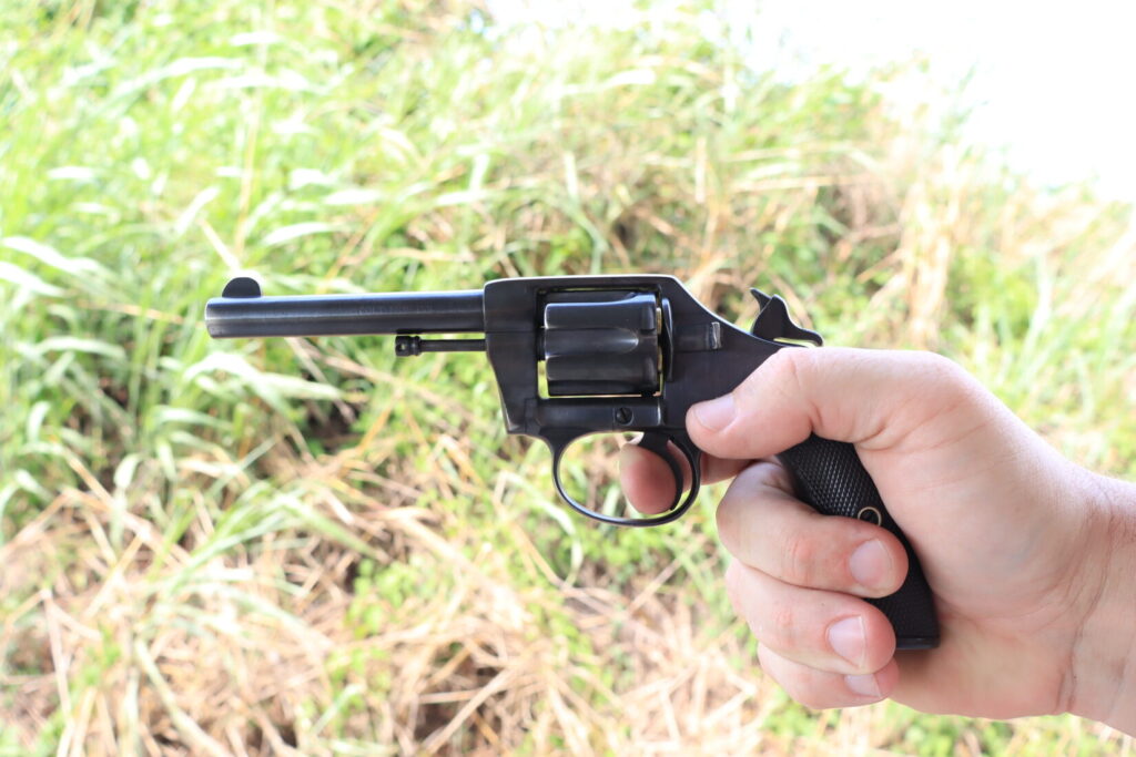 aiming the Colt New Police revolver