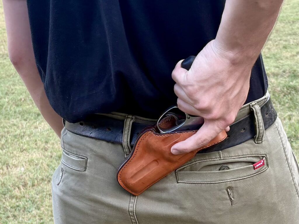 Small of back holsters can be tricky. You don't want to fall on one, and when you draw, you end up sweeping a wide circle with the muzzle. Reholstering can be problematic, too, as the holster isn't easily seen. Use with caution.