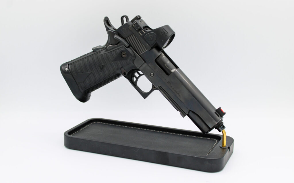 Alchemy Custom Weaponry Quantico HiCap on a black rest on a white background.