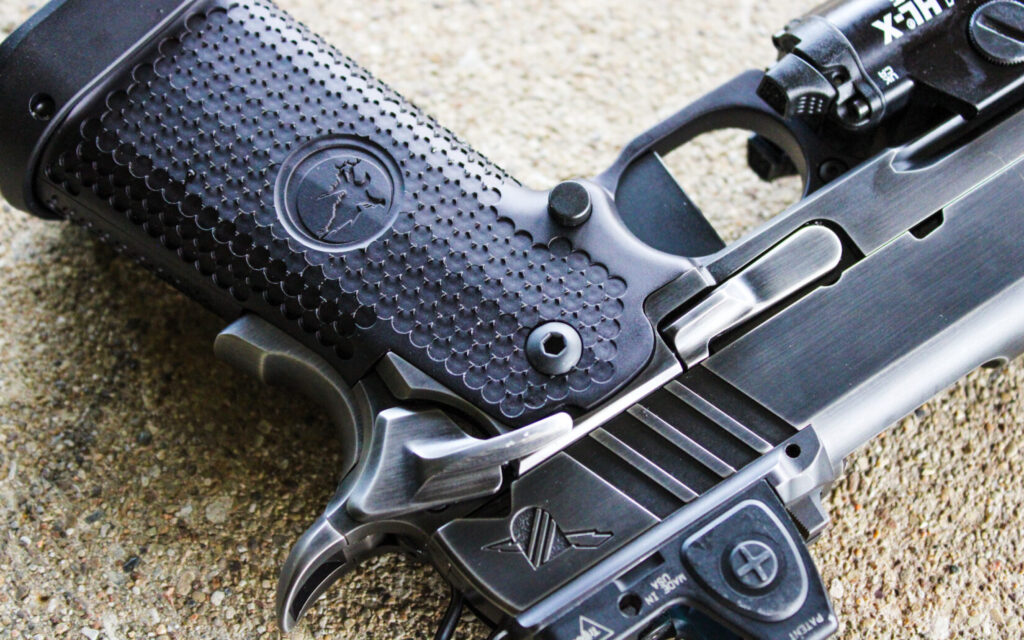 Close up of the Nighthawk Custom Combat Special showing the slide release and magazine release