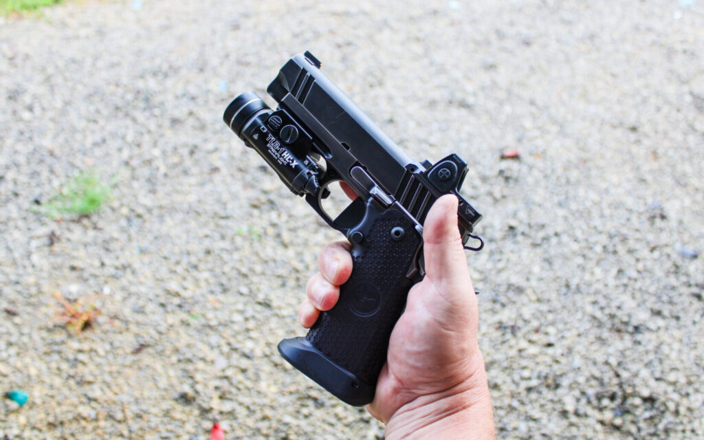 Shooter holding the Nighthawk Custom Combat Special double-stack 1911.