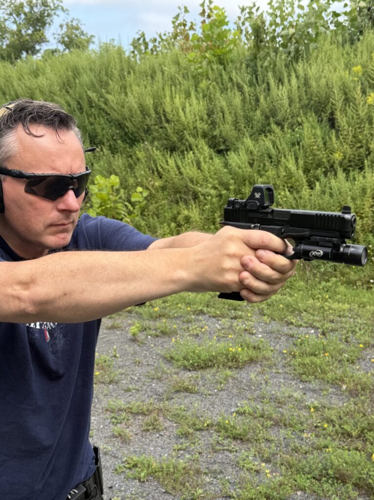Ken Stretz of Stretz Tactical firing a Glock 17 Gen 6 at an outdoor range