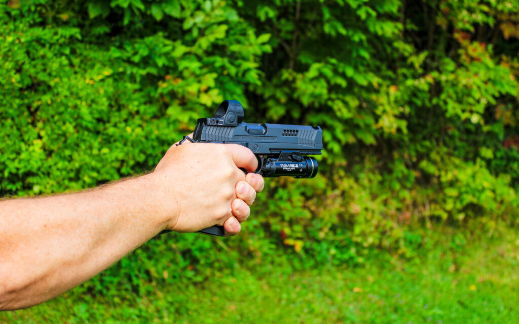 A man shooting a pistol.